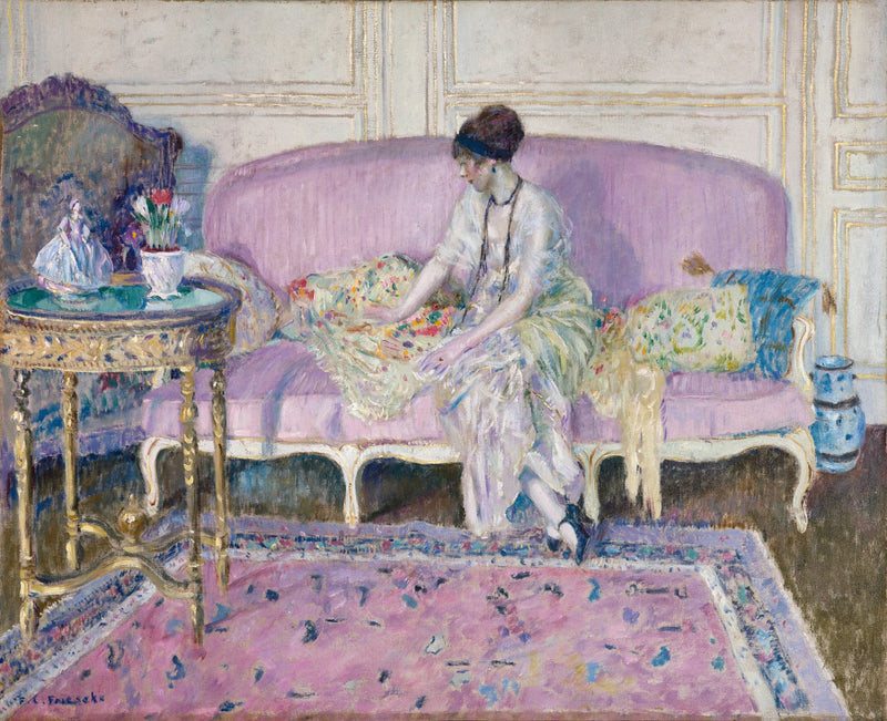 Kvinne sittende på en sofa innendørs - Frederick Carl Frieseke