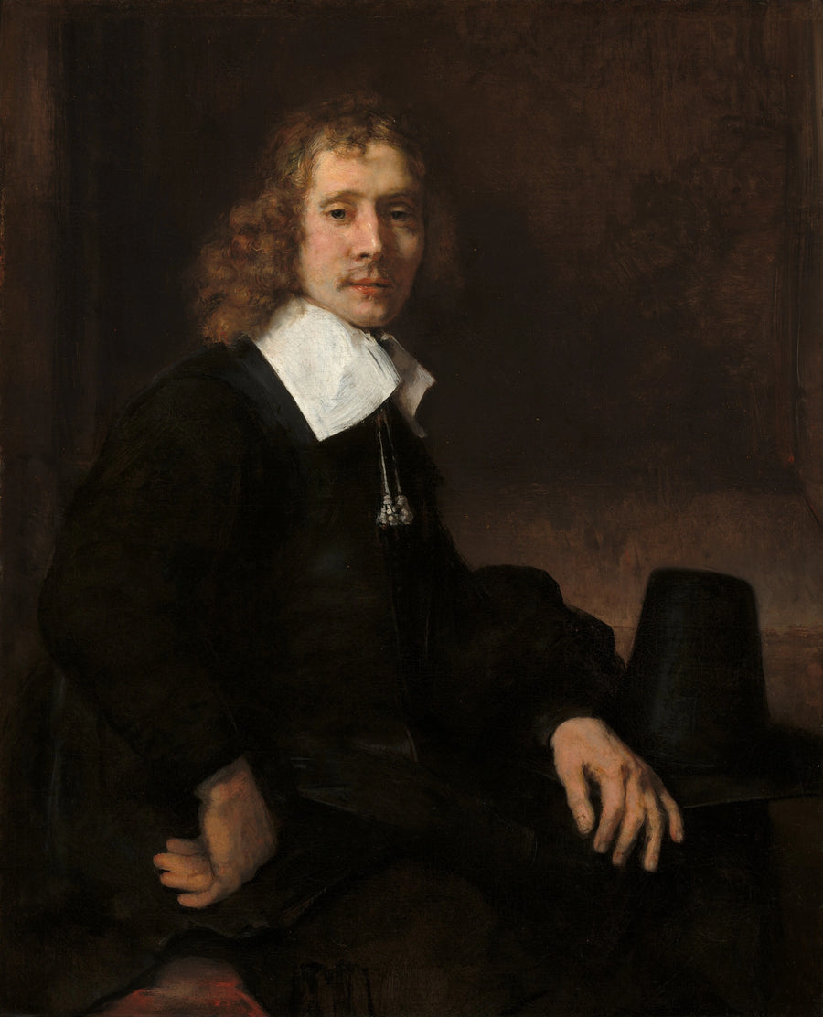 En ung mann som sitter ved et bord (kanskje Govaert Flinck) - Rembrandt