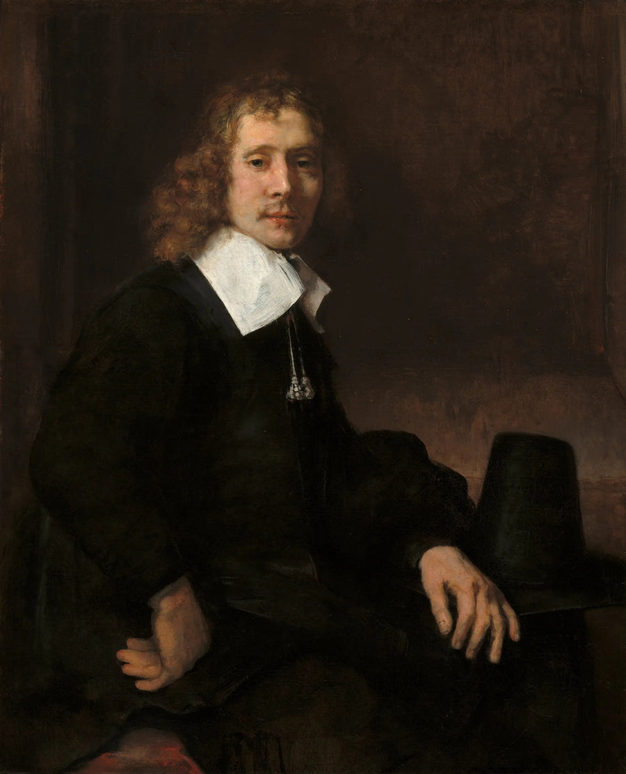 En ung mann som sitter ved et bord (kanskje Govaert Flinck) - Rembrandt
